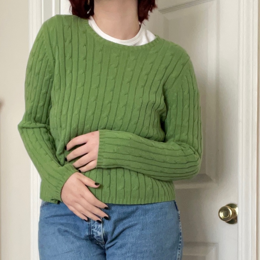 light green cable-knit sweater (form-fitted)
